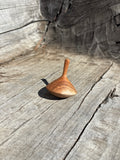 Spinning Tops Made from Local Wood